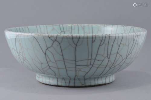 Porcelain bowl. China. Late 19th century. Kuan Yao ware. Bluish celadon glaze with pronounced crab-claw crackle, Five spur marks on the base. 12