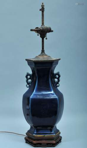 Porcelain vase. China. 18th/19th century. Hexagonal form. Kuei dragon handles. Dark cobalt blue glaze. Drilled and mounted as a lamp.  Height of vase- 15-1/2