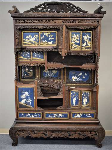 Display  cabinet. Japan. Meiji period. (1868-1912). Cypress wood carved and pierced with birds and flowers. Inset panels of blue and gold lacquer inlaid with birds and flowers in mother of pearl and bone. 81