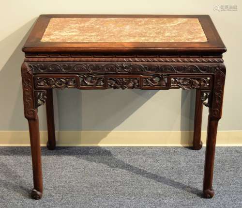Occasional table. China. 19th century. Rosewood carved with floral scrolling. Inset red marble top. 35-1/2
