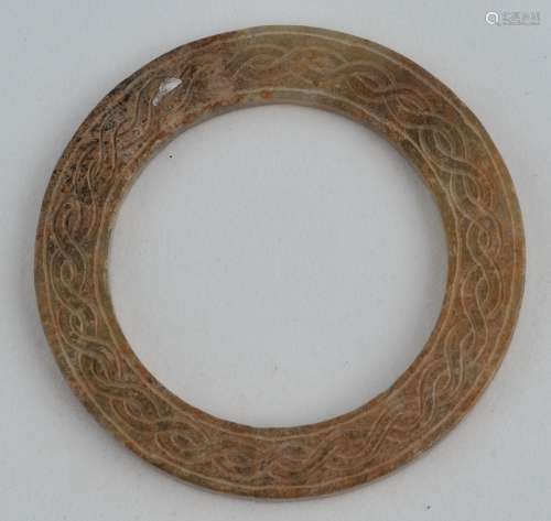 Archaic Ritual Disk. Jade of a tan colour. Surface carved with endless knot pattern. 2-1/4