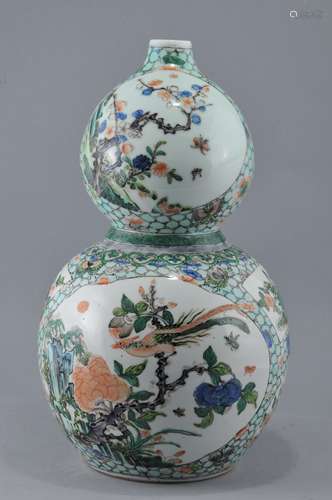 Porcelain vase. China. Late 19th to early 20th century. Double gourd shape. Famille verte decoration of birds and flowers reserves on a 