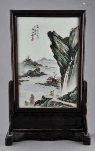 Porcelain plaque. China. Republican period. Circa 1930. Enameled scene of two figures in a landscape. Wooded frame and stand. Screen- 16