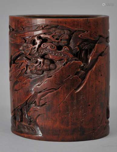 Bamboo brush pot. China. 18th century. Surface carved in high relief with scholars in a mountain landscape. 5-1/4