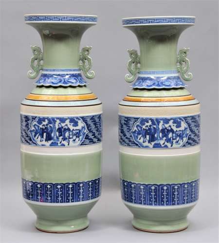 Pair of porcelain vases. China. 19th century Roleau shaped with Kuei dragon handles. Thunder meander border at the mouth with band of celadon. Underglaze blue moulded ju-i with bands of celadon, brown, turquoise and white. Central design of reserves of the Immortals on a crane and colored ground. 24-1/2