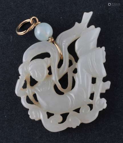 Jade pendant. China. 19th  century. Highly translucent yellow white stone. Carving of an apsara. 2-1/4