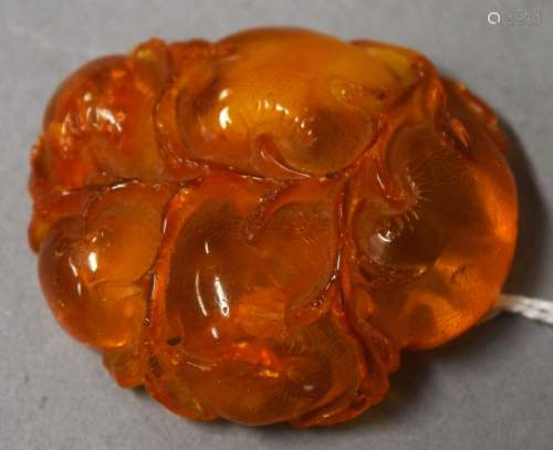 Amber carving. China. 19th century. Study of a group of persimmons. 1-1/2