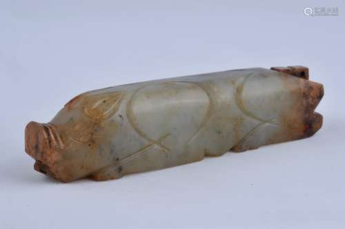Archaic Burial Jade. China. Han period. Stone of a highly translucent grey stone with areas of calcification. Carving of a pig in cylindrical form. 4-3/4