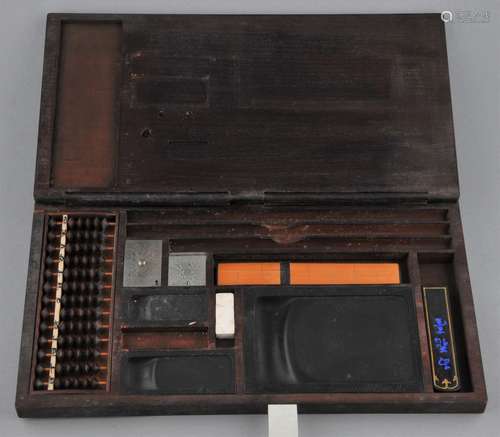 Merchants box. China. 20th century. Interior containing: An abacus, two water droppers, a straight edge, three ink stones and ink.  11-1/4