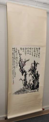 Scroll painting. China. 20th century. Ink and slight colours on paper. Scene of a flowering plum tree with extensive calligraphy.  Scene size: 37