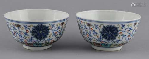 Pair of porcelain bowls. China. Kuang Hsu mark and period (1875-1908). Tou Tsai ware with a decoration of stylized lotus scrolling. 4-1/2