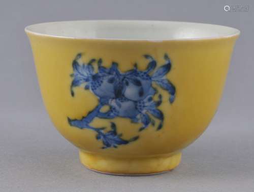 Porcelain cup. China. Early 20th century. Yellow ground with underglaze blue decoration of 