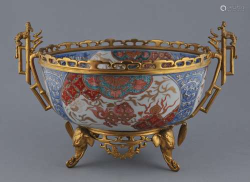 Imari bowl. Japan. 19th century. Decoration of foo dogs, flowering trees and brocade patterns. French ormolu mounts.  14-1/4