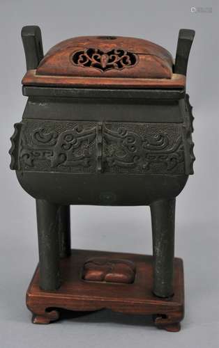 Bronze censer. China. 19th century. Fang Ting form. Decoration of archaic kuei dragons. Fitted stand and cover. 6-3/4