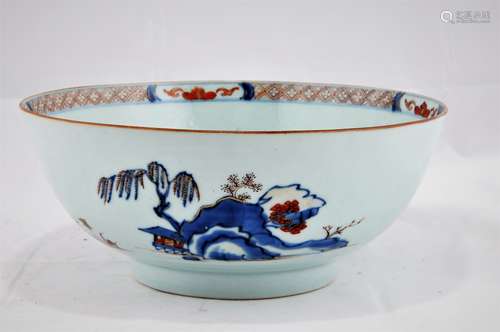 Chinese Export bowl. Circa 1800. Landscape decoration in the Imari palette of underglaze blue, red and gold. 9-1/4