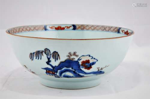 Chinese Export bowl. Circa 1800. Landscape decoration in the Imari palette of underglaze blue, red and gold. 9-1/4
