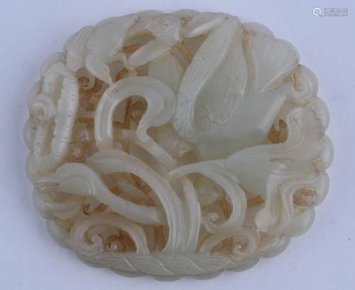 Jade belt plaque. China. Ming period (1368-1644). Pale greenish white stone carved and pierced with a swan and lotus plants. 3