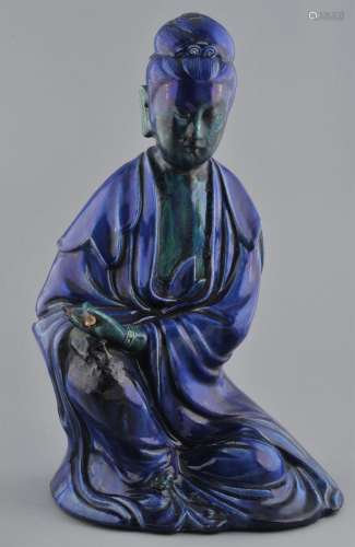 Large stoneware figure. Seated image of The Goddess of Mercy Kuan Yin. Blue and green glazes. 19-1/2