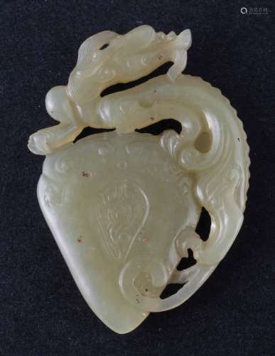 Jade pendant. China. 20th century. Yellow stone. Carving of a dragon and a hear shape. 2