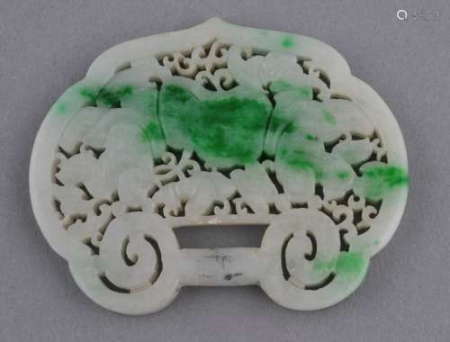 Jade pendant. China. 19th century. White Jade with emerald green markings. Lock shaped carved and pierced with the Ho ho erh hsien and lotus plants. 2-3/4