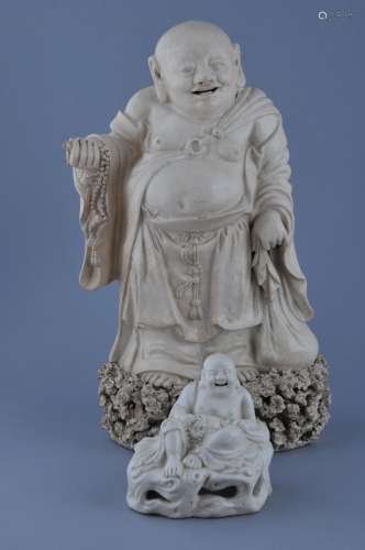 Two pottery figures. China. 19th century. Ivory white glaze. Figures on Mi Lo Fu on rocky outcrops. 12-1/2