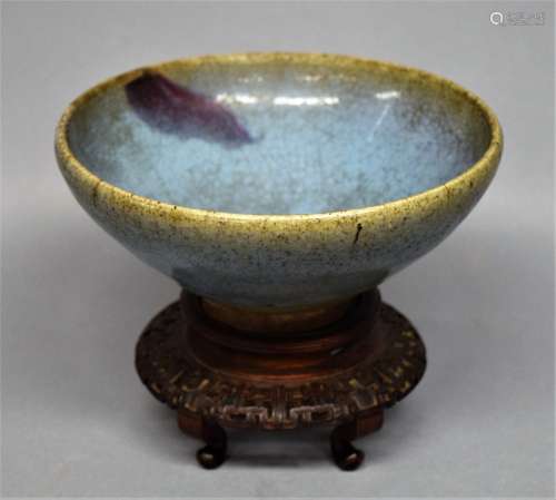 Chun Yao bowl. China. Yuan period (1279-1368). Blue glaze with single splash of purple. Finely  carved rosewood stand. 7-1/4