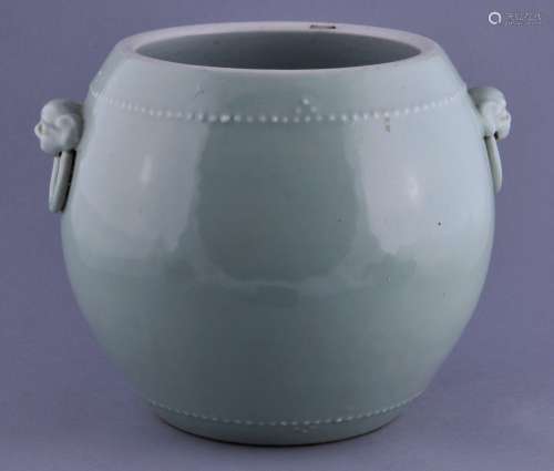 Celadon vase. China. 19th century. Drum shaped with foo dog jump ring. Two character Hsuan Ho mark on the base. 8-3/4