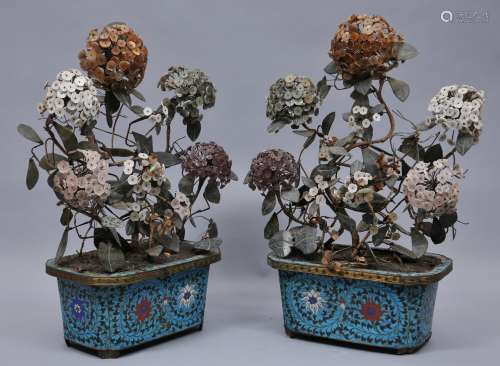 Pair of planters. China. 19th century. Cloisonné bases with stylized lotus scrolls on a turquoise ground. Hydrangea flowers of amethyst, shell and jade. 20