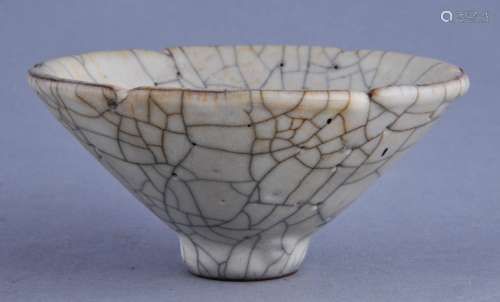 Porcelain cup. China. 20th century. Conical form. K'o Yao type glaze. Ivory white with a pronounced crackle. 4-1/4