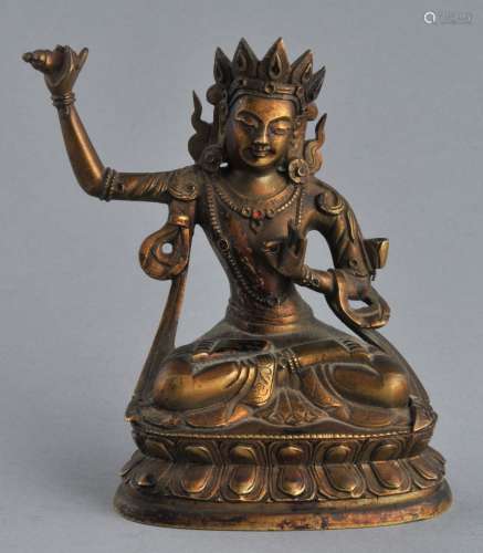 Gilt bronze image. China. 19th seated image of Vajrasaattra. Floral element missing from the right arm. 4