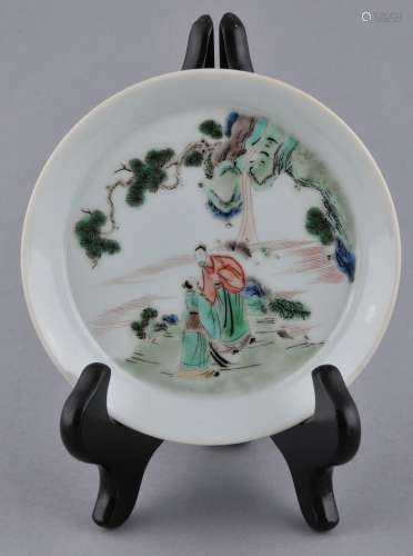 Porcelain saucer dish. China. 20th century. Famille Verte decoration of two scholars. 8 characters. K'and Hsi hall mark on the base. 4-3/4