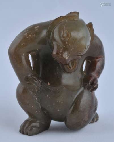 Jade dancing bear. China. Probably Han period. Green stone with russet area and areas of calcification. 3