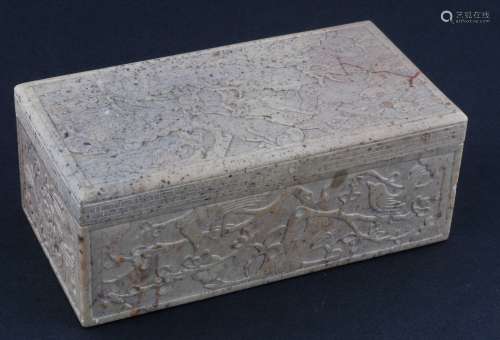 Carved soapstone box. China. 19th century. Rectangular form. Surfaces carved in relief with dragons and birds in flowering trees. 7