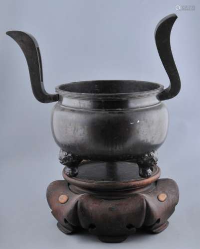 Bronze censer. Japan. 19th century. Heaven soaring handles. Animal head feet. Carved wooden stand. 16-1/2