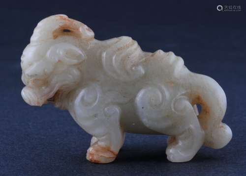 Jade carving. China. 18th/19th century. Stone of a grey colour with russet markings. Carving of a single horned mythical animal. 2-3/4