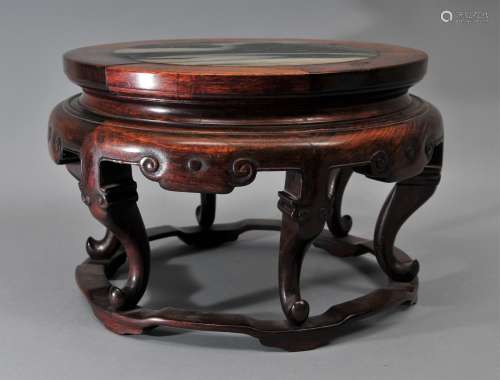 Scholars stand. China. 18th century. Carved Rosewood. Circular form with cabriole legs. Top inset with a black and white marble dram stone. 12