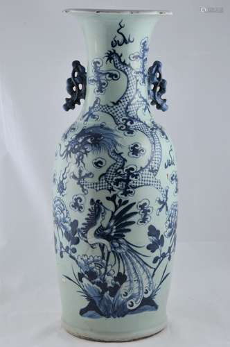 Porcelain vase. China. 19th century. Cloud form handles, scalloped edge. Underglaze blue dragon decoration of a pale celadon ground. 23