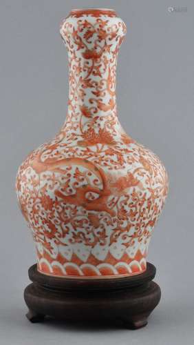 Porcelain vase. China. 20th century. Garlic mouth type. Iron red and gilt decoration of dragons and floral scrolling. 9-1/4