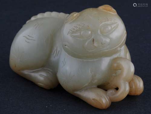 Jade carving. China. 19th century. Celadon coloured stone with a yellow area. Study of a cat. 2-3/4