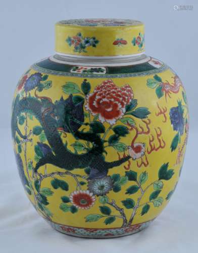 Porcelain covered jar. China. Late 19th century. Decoration of dragons and peony flowers on a yellow ground. 13