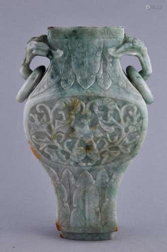 Jade jar. China. Late 19th/Early 20th century. Green stone with russet areas. Foo Dog jump rings. Floral reserves with acanthus borders. (no cover). 8