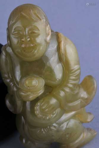 Jade carving. China. 20th century. Yellow green stone. Carving of a boy holding a silver ingot and a Buddhist rosary. 3