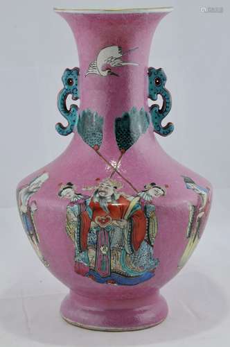 Porcelain vase. China, 19th century. Famille Rose  decoration of The Immortals on pink scraffeto ground. Kuei dragon handles. 15