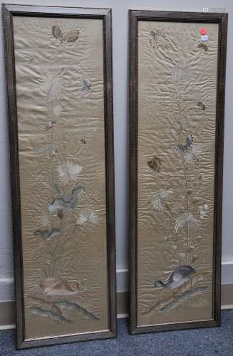 Pair of embroidered silk panels. China. 19th century. Butterflies, birds and flowers on an ivory colored ground. 40