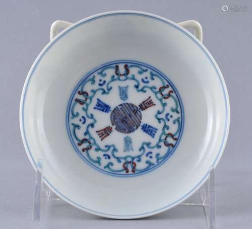 Porcelain saucer dish. China. Early 20th century. Tou Tsai ware. Decoration of stylized Shou characters and ribbons. Yung Cheng mark. 4-3/4