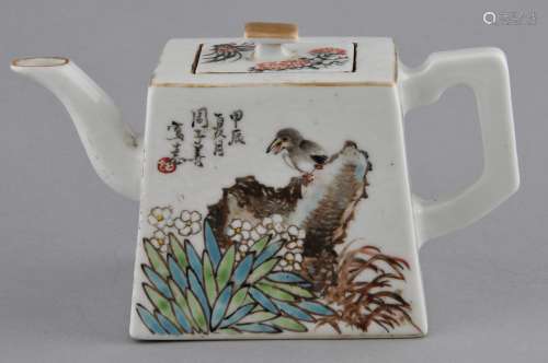 Porcelain teapot. China. Republican period. Seal shape. Decoration of birds, flowers and landscape with calligraphy. Ch'ien Lung mark on the base. 6-1/2