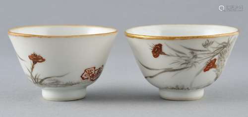 Pair of wine cups. China. Republican Period. Grisaille decoration of orchids with gilt. Signed with a seal. 2-1/4