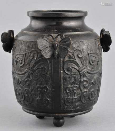 Bronze vase. Japan. Meiji period. (1868-1912). Decoration of Archaic Tao Tieh masks and four butterfly handles. 5