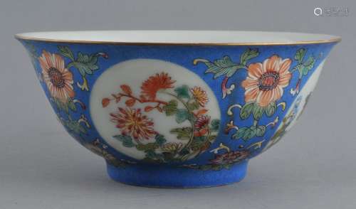 Porcelain bowl. China. 20th century. Scraffeto carved blue ground with Famille Rose reserves of flowers. Ch'ien Lung mark. 6