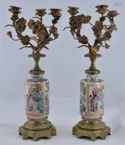 Pair of Rose Mandarin vases. China. Late 19th century. European brass mountings of foliated candelabras. 19